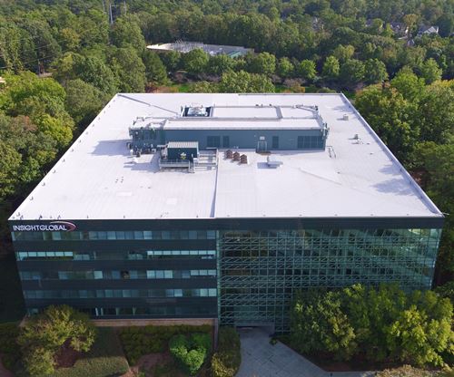 Aerial view of the Insight Global office building surrounded by trees.