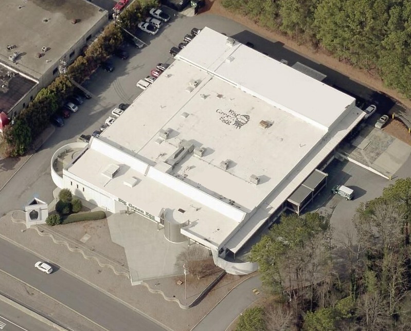 Aerial view of the Big Green Egg corporate headquarters building with the company logo on the roof.